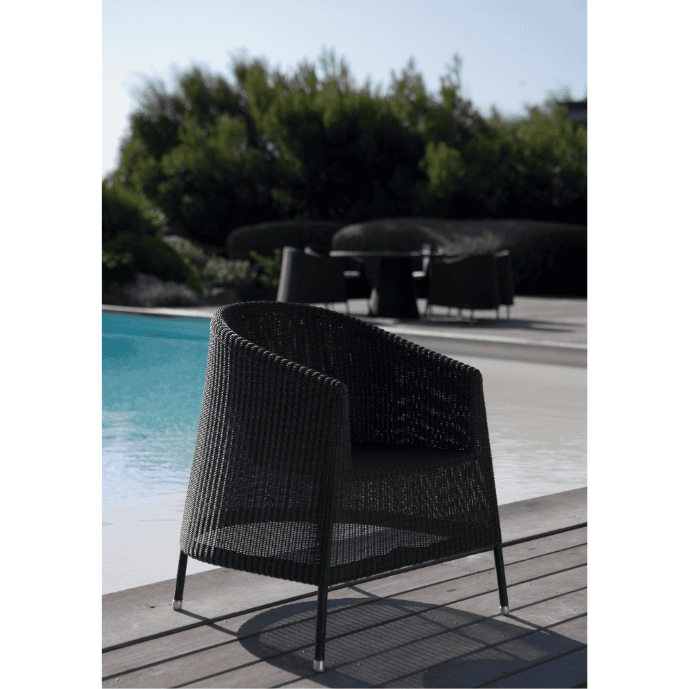 Boxhill's Kingston Outdoor Stackable Lounge Chair Mocca lifestyle image on wooden poolside