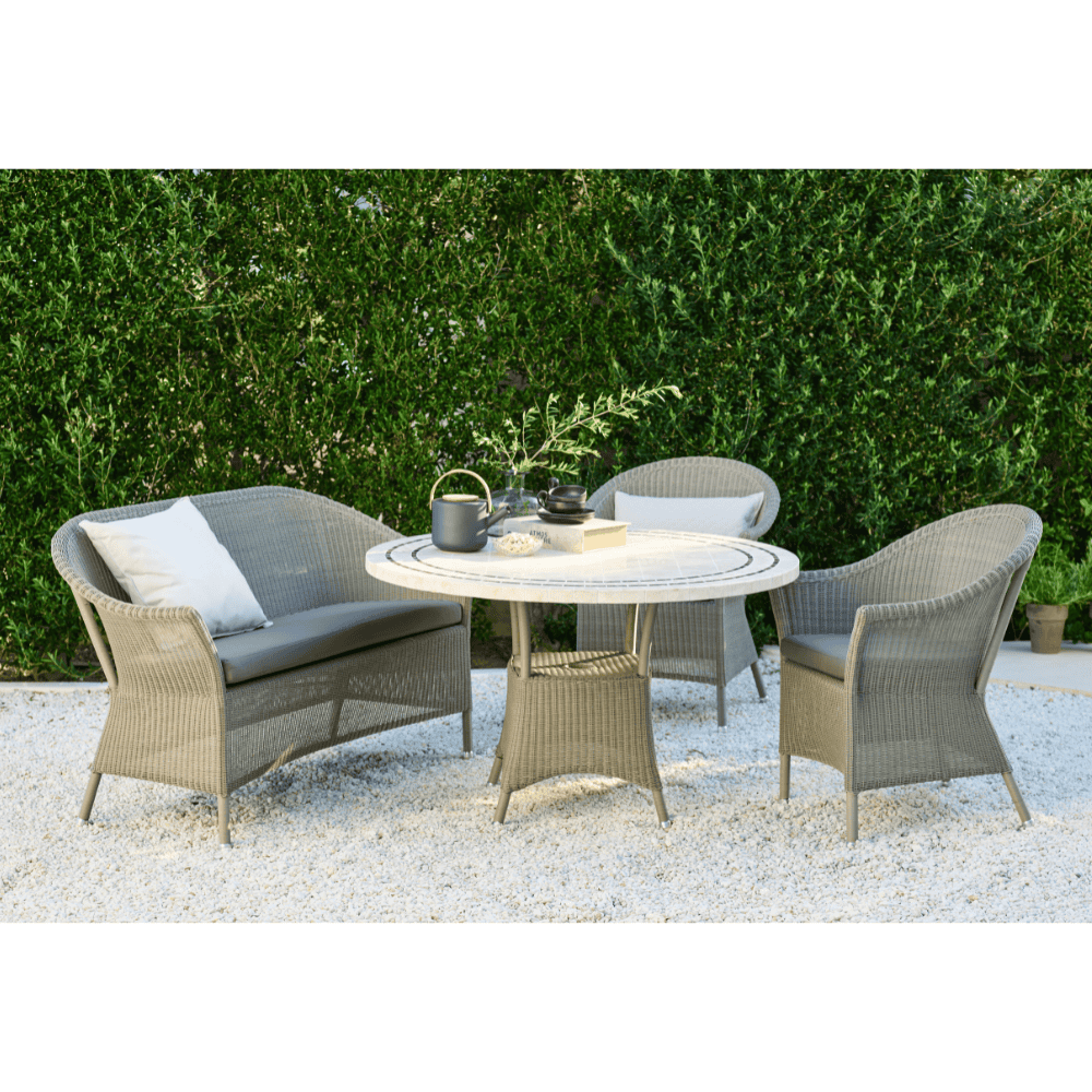 Boxhill's Lansing Outdoor 2-Seater Sofa Taupe lifestyle image with Lansing Outdoor Lounge Chair and Lansing Outdoor Round Dining Table at patio