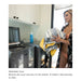 A woman in a kitchen-like laundry area holds a yellow and white patterned cover while explaining its use. Text at the bottom reads 'Washable Cover' and 'Remove the cover and toss it in the washer.