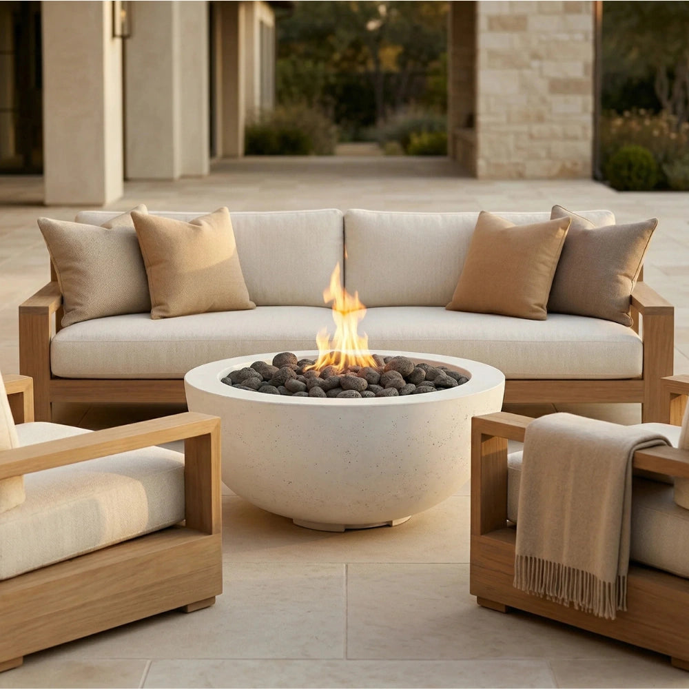 Outdoor patio setting with a round concrete fire pit and comfortable seating area.