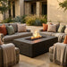 Outdoor patio with fire pit table and comfortable seating area.