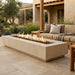 Outdoor patio with a fire pit table and seating area.
