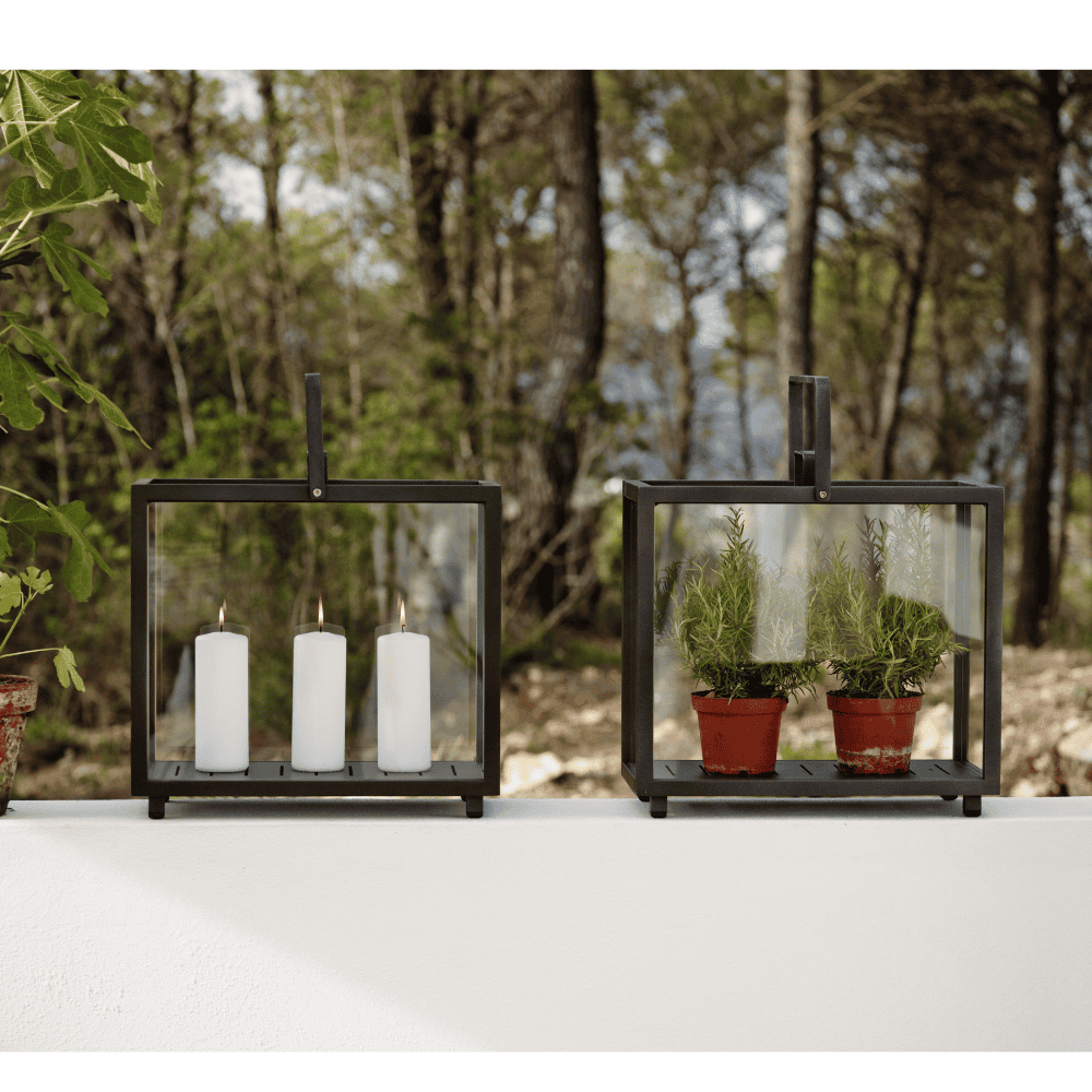 Boxhill's Lighthouse Outdoor Large Aluminum Lantern for Candles | Set of 2 lifestyle image with candle and plants inside