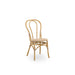 Natural rattan outdoor dining side chair featuring a woven wicker seat and double-loop backrest.