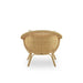 Rear view of a natural rattan outdoor lounge chair with a woven backrest and curved arms.