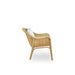 Side view of a natural rattan outdoor lounge chair with a woven backrest and curved arms.