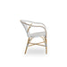 Side view of white rattan outdoor dining armchair featuring a black and white woven wicker seat and back.
