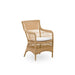 Natural rattan outdoor dining armchair with a white cushion featuring an open woven frame and straight back.