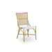 Natural rattan outdoor dining side chair featuring black and white woven wicker seat and back.