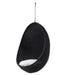 Black rattan outdoor hanging egg chair with a white cushion suspended by a metal chain.
