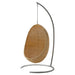 Natural rattan outdoor hanging egg chair suspended by a metal chain.