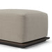 Square outdoor ottoman in beige fabric with aluminum base, plush cushion, close-up view