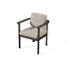 A modern outdoor aluminum dining chair in black frame and a plush beige quick dry upholstered seat that has barrel-back profile, deep seat, and wide arms.