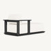 Rectangular outdoor chaise lounge in black aluminum frame with white cushion, fixed design, side view