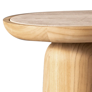 Close-up of a light natural wood side table showing the rounded overhanging tabletop and thick cylindrical pedestal base on a white background.