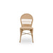 Natural rattan outdoor dining side chair in a light tan finish with an open woven back.