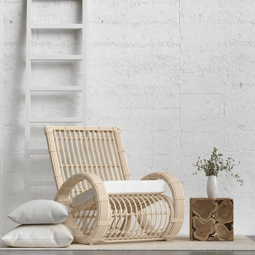 Boxhill's Paloma Outdoor Club Chair lifestyle image with side table and ladder at the back