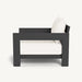  A black and white aluminum lounge chair adorned with white pillows, showcasing a modern and minimalist design.