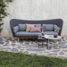 Boxhill's Peacock dark grey outdoor wing 3-seater sofa with grey and white outdoor round table placed in patio