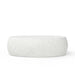 Oval shaped white concrete outdoor coffee table with speckled texture on a white background