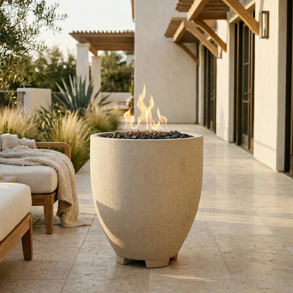 Outdoor patio with a tall cylinder-shaped concrete white fire pit and seating area