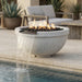 Outdoor round concrete white fire pit with water feature next to a pool