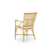 Natural rattan outdoor dining armchair viewed from the angled rear with an open woven back and curved armrests.