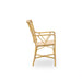 Natural rattan outdoor dining armchair viewed from the side with an open woven back and curved armrests.