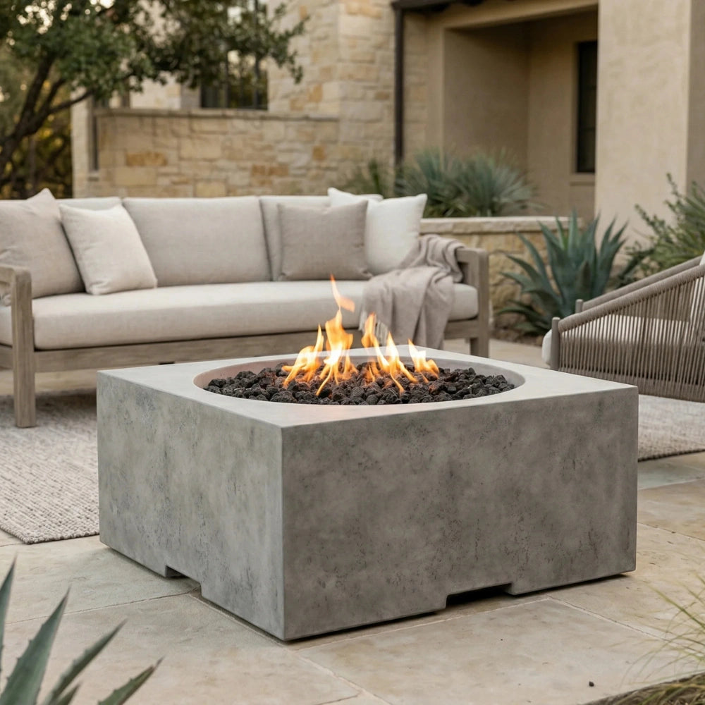 Outdoor patio with a square concrete outdoor fire pit table and seating area.