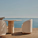 Porto Travertine Pill Outdoor Dining Table 108" Lifestyle