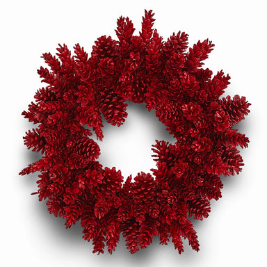 Handcrafted red pinecone wreath with glossy finish on a plain white background.