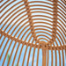 Close-up of the natural rattan outdoor hanging swing chair interior with woven frame detailing.
