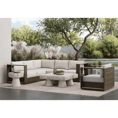 An L-shaped sectional sofa that is made with matte bronze aluminum and solvita fabric.