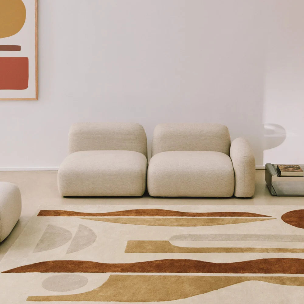 Rectangular rug in beige and brown hand-tufted polyester with abstract pattern, styled in living room