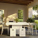 Covered patio with square white concrete outdoor dining table, two white stools, and four white chairs