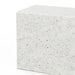 Close-up of a white rectangular concrete outdoor bench with speckled texture on a white background