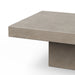 Close-up of a modern gray textured concrete rectangular patio coffee table on a white background