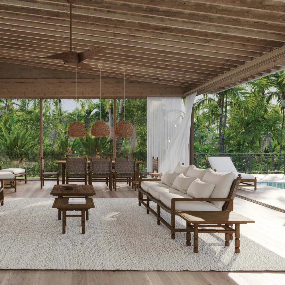 Outdoor patio area with wooden furniture and a pool view.
