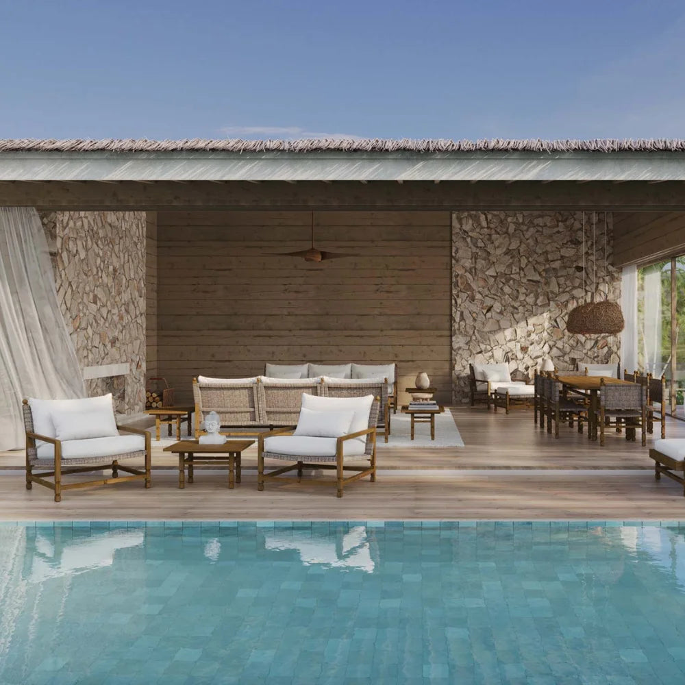 Outdoor patio area with furniture and a pool in front
