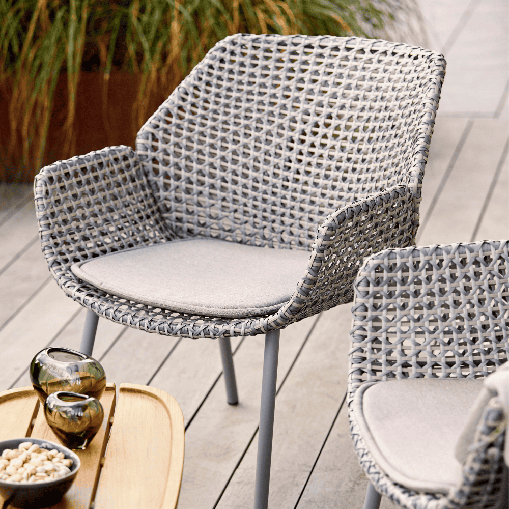  Boxhill's Vibe light grey outdoor armchair with teak rectangular outdoor side table on wooden platform