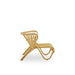 Natural rattan outdoor lounge chair viewed from the side with a sculptural woven frame.