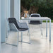 Boxhill's Breeze Dining Weave Chair White Grey lifestyle image with table at patio near the tree