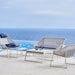 Boxhill's Breeze Highback Outdoor Chair White Grey lifestyle image with Breeze 2-Seater Sofa and Breeze Lounge Chair beside the pool