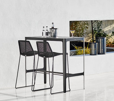 Boxhill's Breeze Bar Stackable Chair Black lifestyle image with bar table