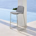 Boxhill's Breeze Bar Stackable Chair White lifestyle image piled up beside the pool