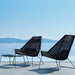 Boxhill's Breeze Highback Outdoor Chair Black lifestyle image on rooftop at the sea front