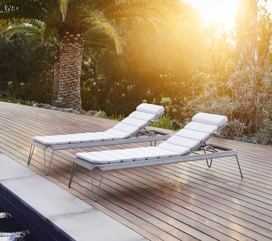 Boxhill's Breeze Stackable Sunbed lifestyle image beside the pool