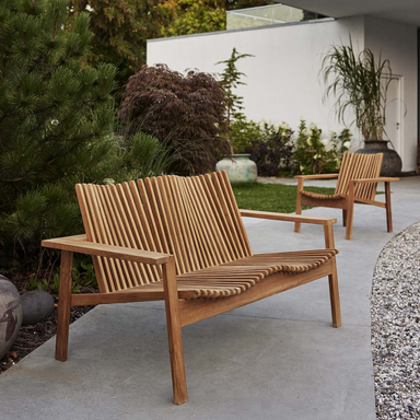 Boxhill's Amaze 2-Seater Teak Sofa lifestyle image with Amaze lounge chair