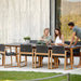 Boxhill's Aspect Dining Table Fossil Black lifestyle image with 3 people 