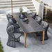 Boxhill's Aspect Dining Table Fossil Black lifestyle image beside stairs